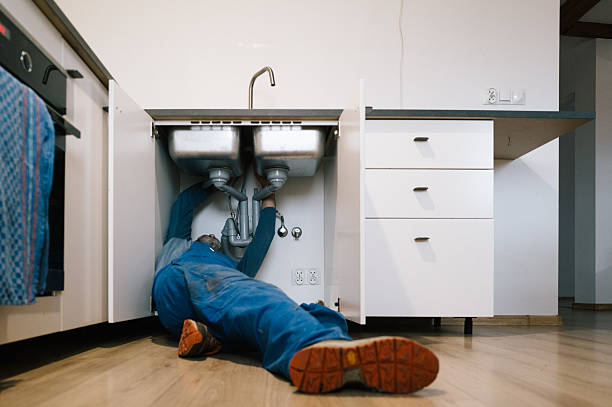 Professional Emergency Plumber technician working in Adrian, MO